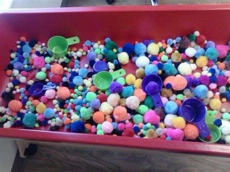 Pom Pom Sensory Table Great For Comparing Sizes And Counting As Well