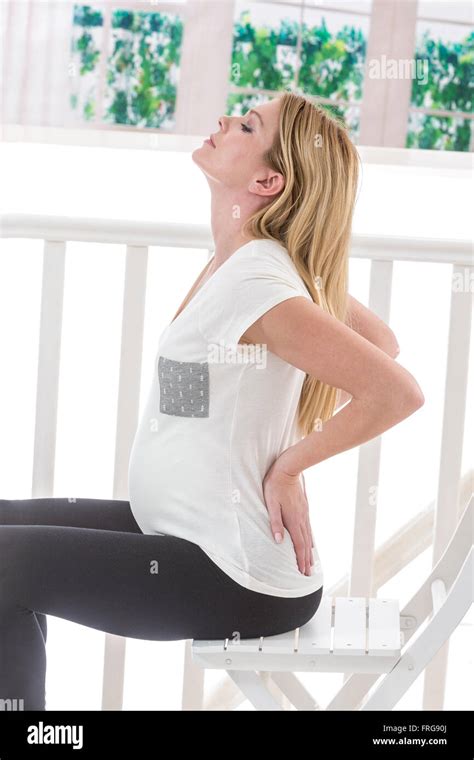 Pregnant woman with back pain Stock Photo - Alamy