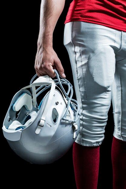 Premium Photo Cropped Image Of American Football Player Holding Helmet