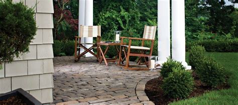 an outdoor patio with chairs and tables on it