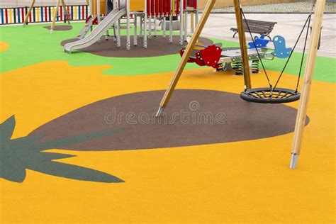 Empty Playground With Swings And Safe Rides With Anti Traumatic Bright