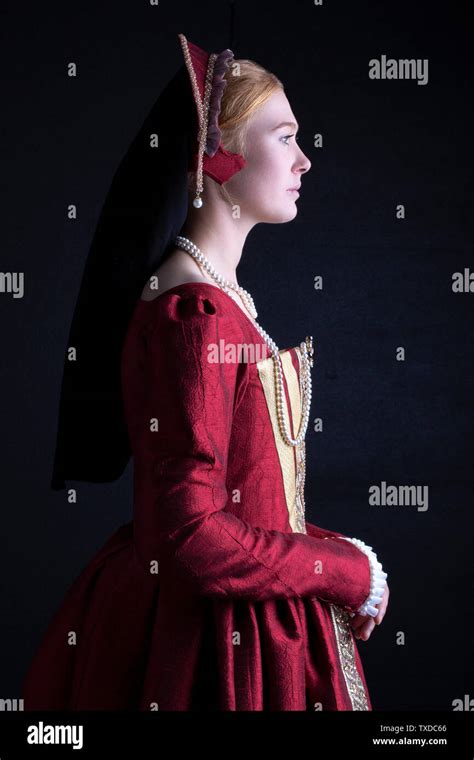 Tudor Woman In Red Dress On Black Background Stock Photo Alamy