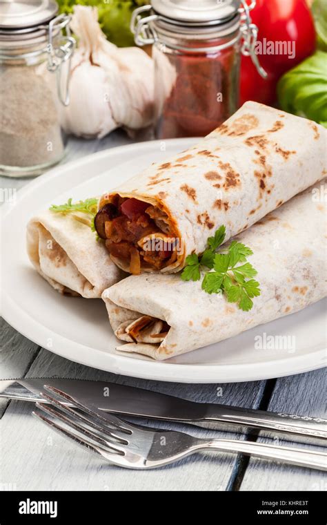 Mexican Burritos Wraps With Mincemeat Beans And Vegetables On A Plate