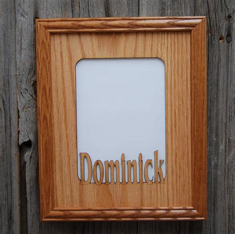 A Wooden Frame With The Word Domittick Carved Into It