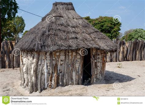 an old wooden hut with thatched roof