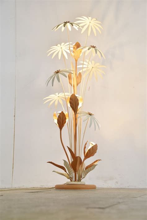 A Vase With White Flowers On Top Of A Table