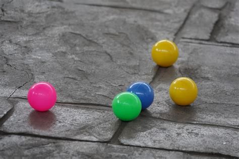 Premium Photo | Colorful balls on the concrete floor