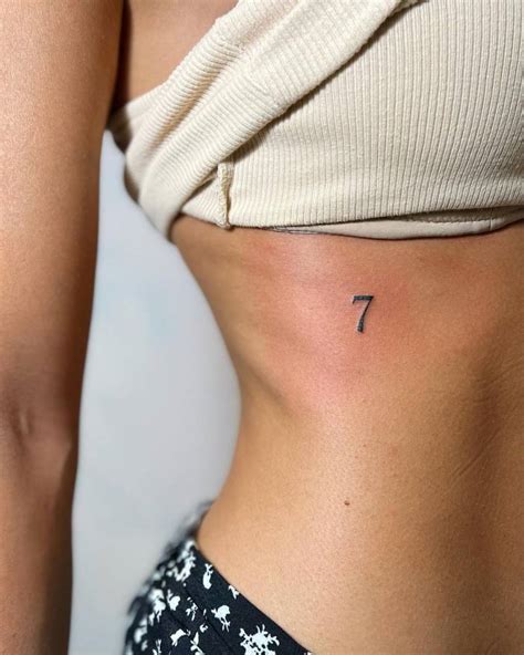 Minimalistic Number 7 Tattoo Located On The Rib