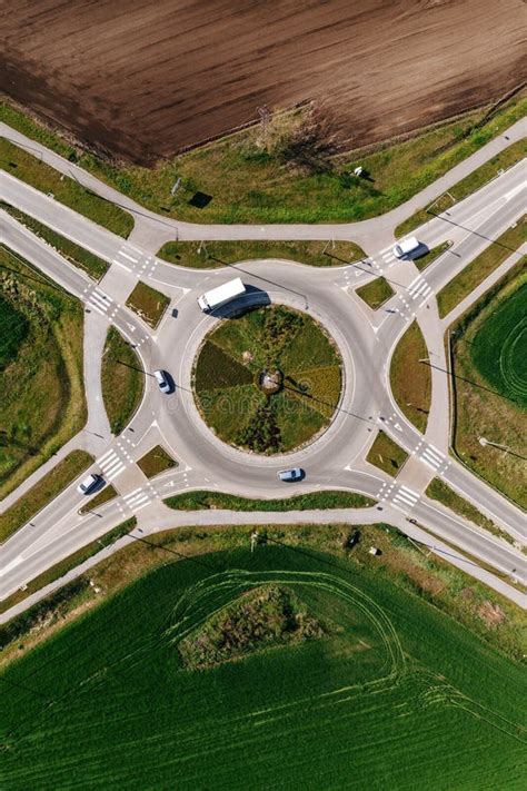 Roundabout Intersection Road Traffic With Many Cars Aerial Shot From