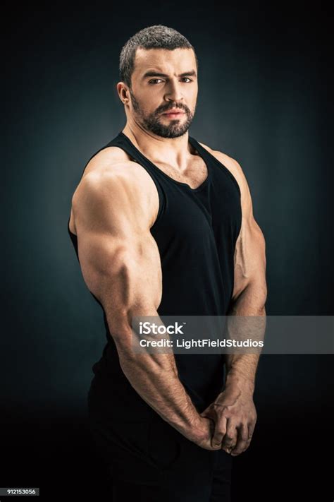 Strong Man Showing Muscles Stock Photo Download Image Now Active