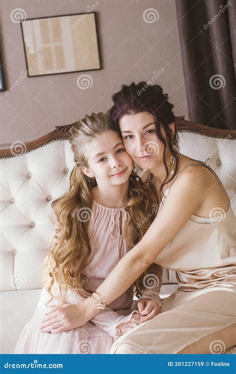 Lovely And Elegant Mother And Daughter In Beautiful Fashionable