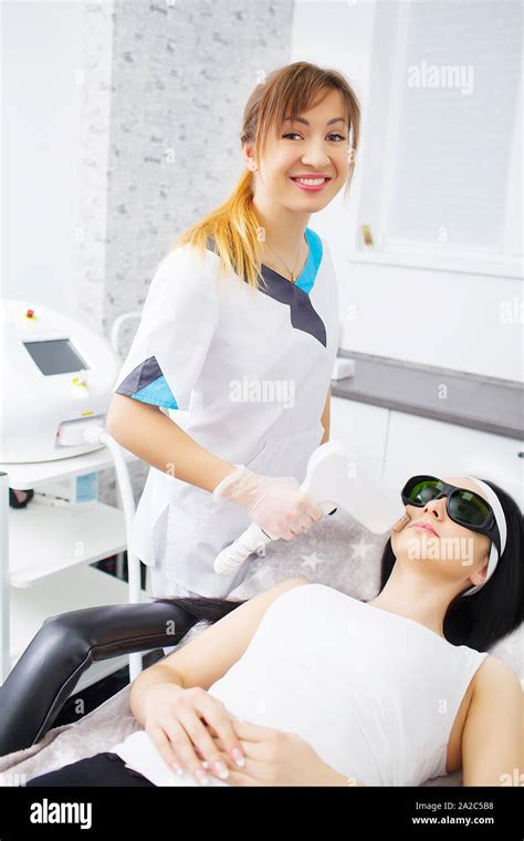 The Doctor Cosmetologist Makes The Procedure Microcurrent Therapy Of