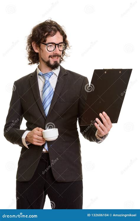 Happy Handsome Caucasian Businessman Reading Clipboard While Hol Stock