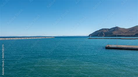 Seascape With A Lighthouse On The Kuzu Limani Harbour On The Island Of