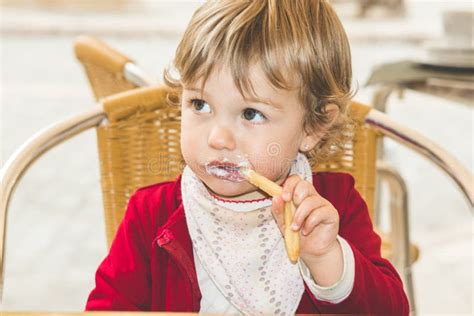 Child eating chips stock image. Image of expression - 117317595