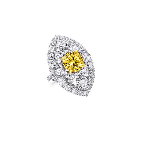 A Graff Ring Featuring A Fancy Vivid Yellow Round Diamond Engagement