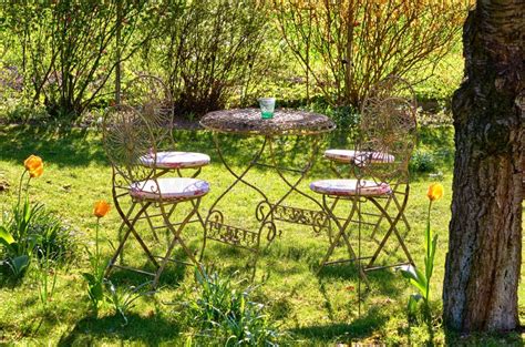 Retro Metal Table and Chairs in the Garden Under an Old Tree Stock Photo - Image of creative ...