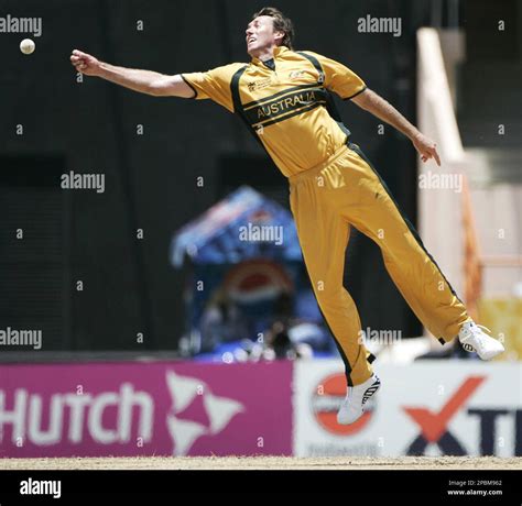 Australias Glenn Mcgrath Reaches Out To Attempt A Catch While Bowling