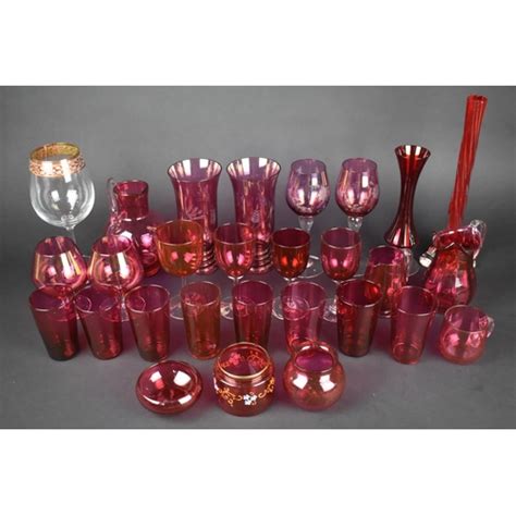 A Collection Of Various Cranberry Glass To Comprise Drinking Glasses