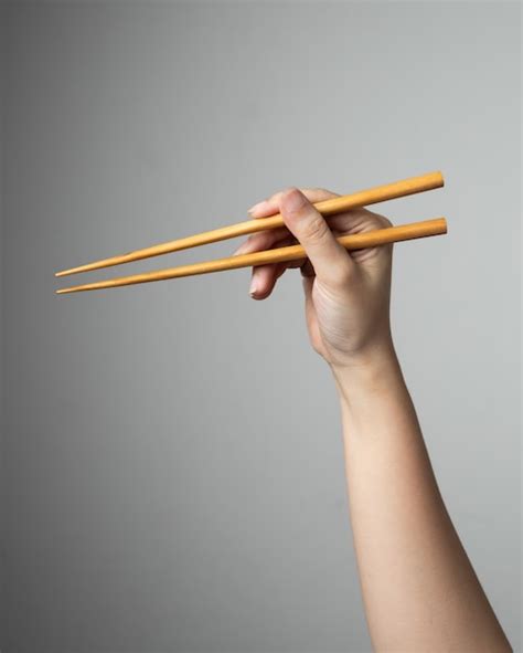 Premium Photo Hand Chopstick Asian Japanese Chinese Food Style