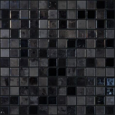 A Black And White Tiled Wall With Square Tiles On The Bottom Dark Gray