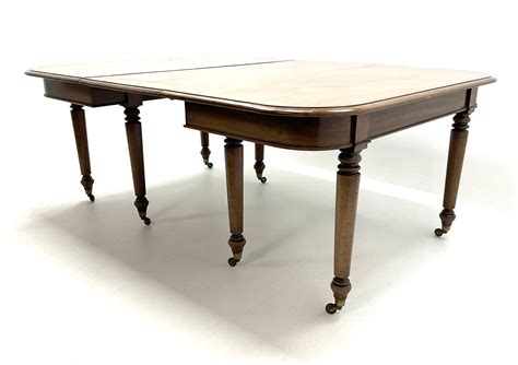 19th Century Figured Mahogany Dining Table Two D Ends And Leaf On Turned Supports Terminating