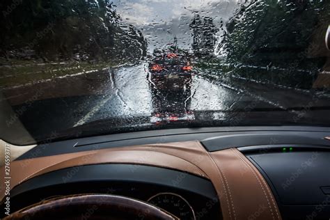 The Car Goes In The Rain View From The Inside Raindrops On The