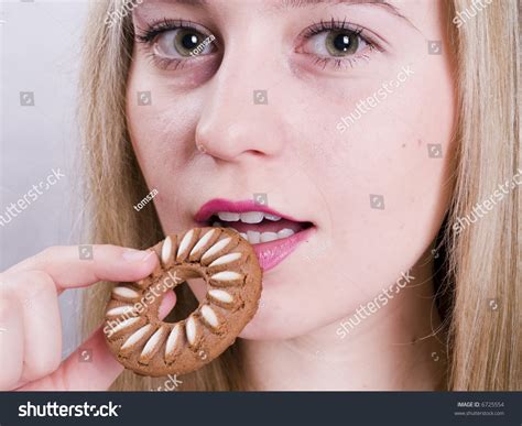 Attractive Blonde Girl Eating Cookie Stock Photo Shutterstock