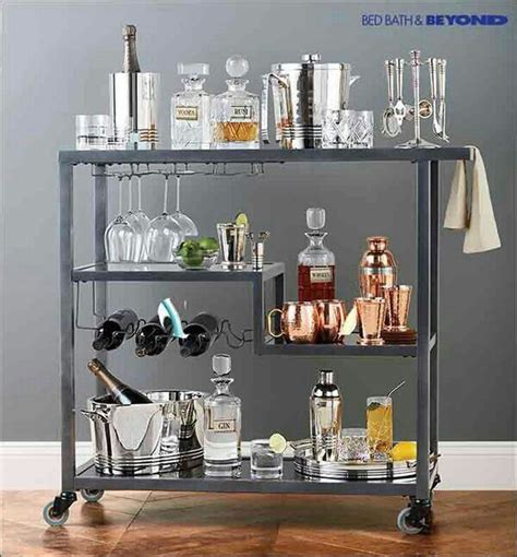 A Metal Bar Cart Filled With Lots Of Liquor Bottles And Glasses On Top