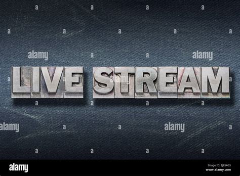 Live Stream Phrase Made From Metallic Letterpress On Dark Jeans