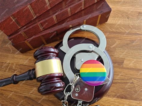 Premium Photo Flag Of Lgbt Community With A Judge Gavel And Handcuffs