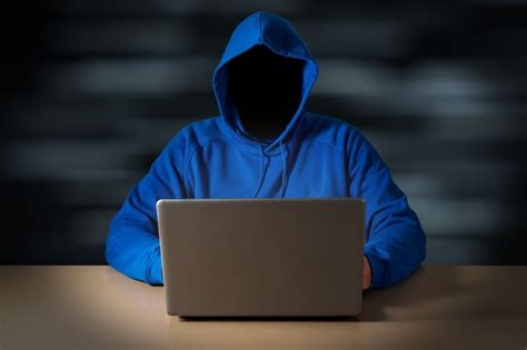 Premium Photo Computer Hacker Steals Data From Laptop