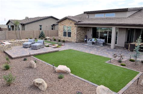 This Xeriscaped Yard Has Pavers Rock And Artificial Turf Building