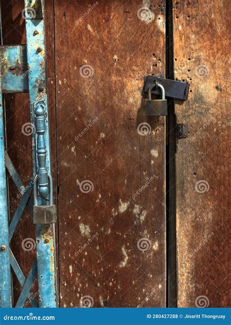 Locked Old Damaged Wooden Doors Royalty Free Stock Photography