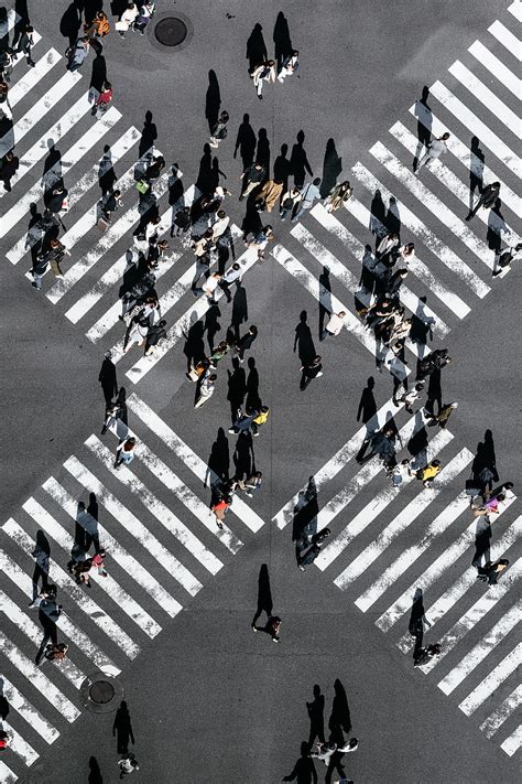 Aerial View Of People Walking On Cross Pedestrian Lane HD Phone