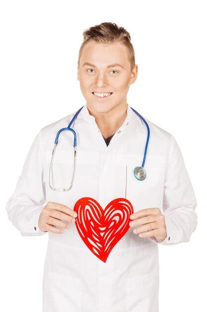 Premium Photo Young Male Doctor In White Coat With Red Heart In Hand