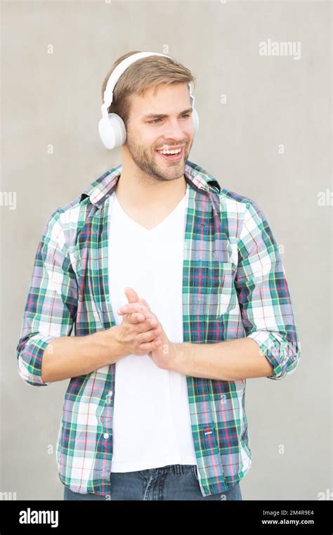 Happy Man Listening Music And Wearing Checkered Shirt Photo Of Man