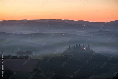 Podere Belvedere House On A Hills In Tuscany In Italy At Sunrise With