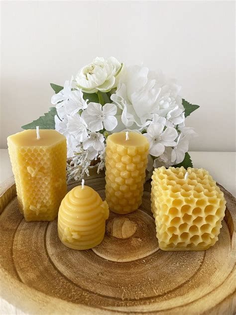 Beeswax Candles And Flowers On A Wooden Tray