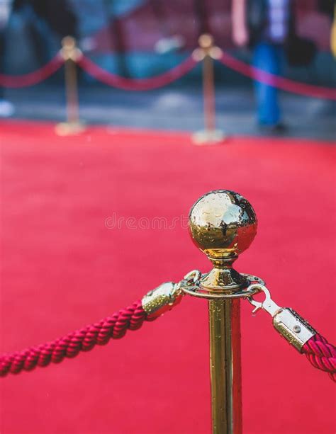 Red Carpet With Ropes And Golden Barriers On A Luxury Party Entrance