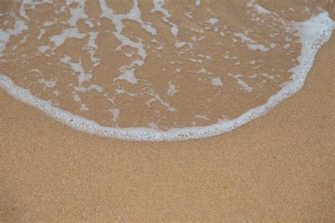 Premium Photo | Beach sand and ocean waves background