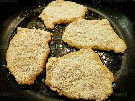 breaded wiener schnitzel with side dishes 24056267 Stock Photo at Vecteezy