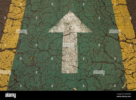 White Arrow Painted On The Ground Stock Photo Alamy