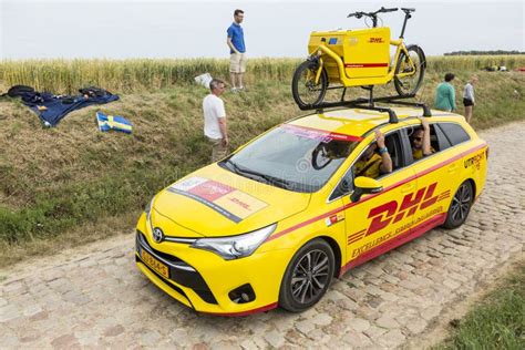 DHL Vehicle On A Cobblestone Road Tour De France 2015 Editorial