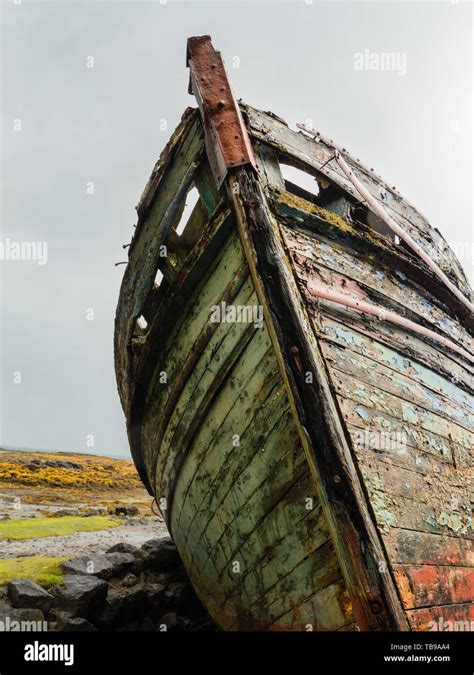 Two Abandoned Fishing Boats Along The Shore Of Salen Bay On The Island