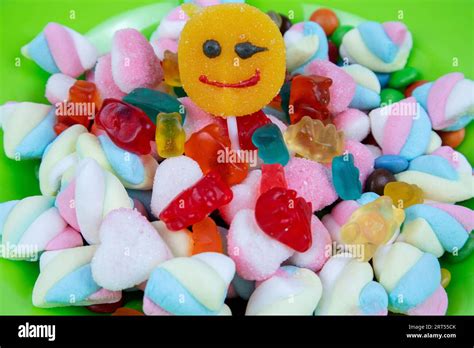 Piles Of Various Kinds Of Sweets And Candies With A Focus On The