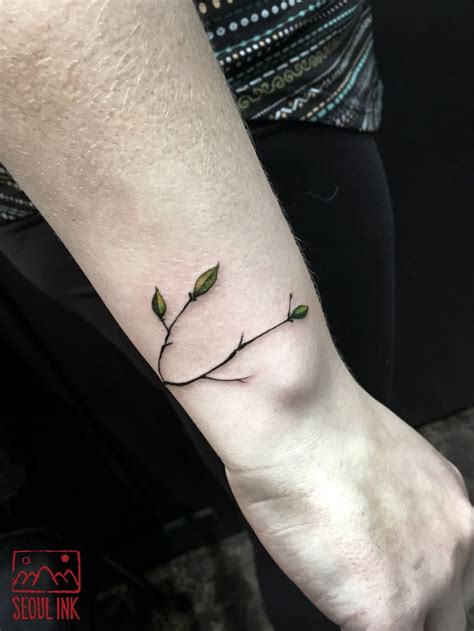 Small tree branch tattoo