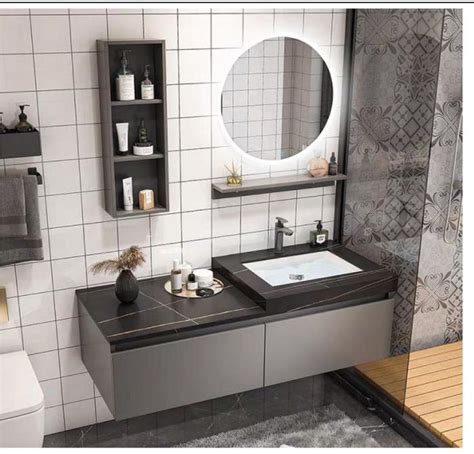 A Bathroom With A Sink Mirror And Shelves