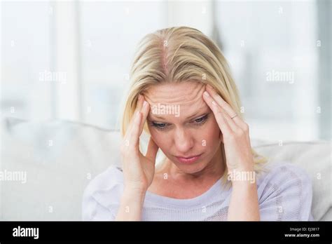 Upset Woman Rubbing Her Temples Stock Photo Alamy