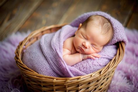 Portrait Of Newborn Baby Sleeping In Basket Premium AI Generated Image